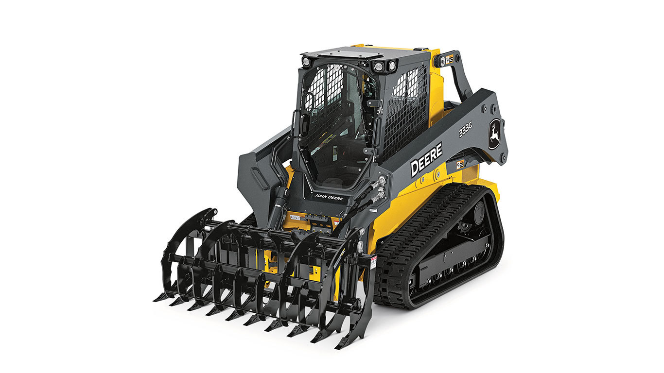 333G Compact Track Loader with Root Rake attachment on white background