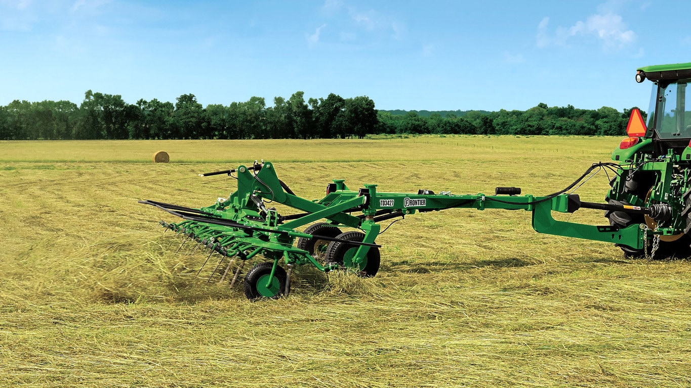 field image of Frontier™ td34 hay tedder attached to a tractor