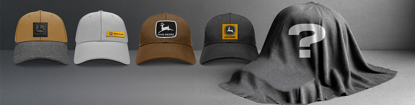 Lineup of branded caps with one covered hat marked by a question mark.