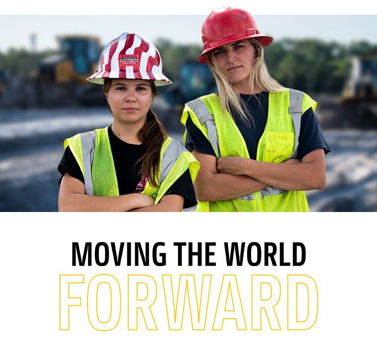 Two young women posed in from of equipment with the headline “Moving the world forward”.