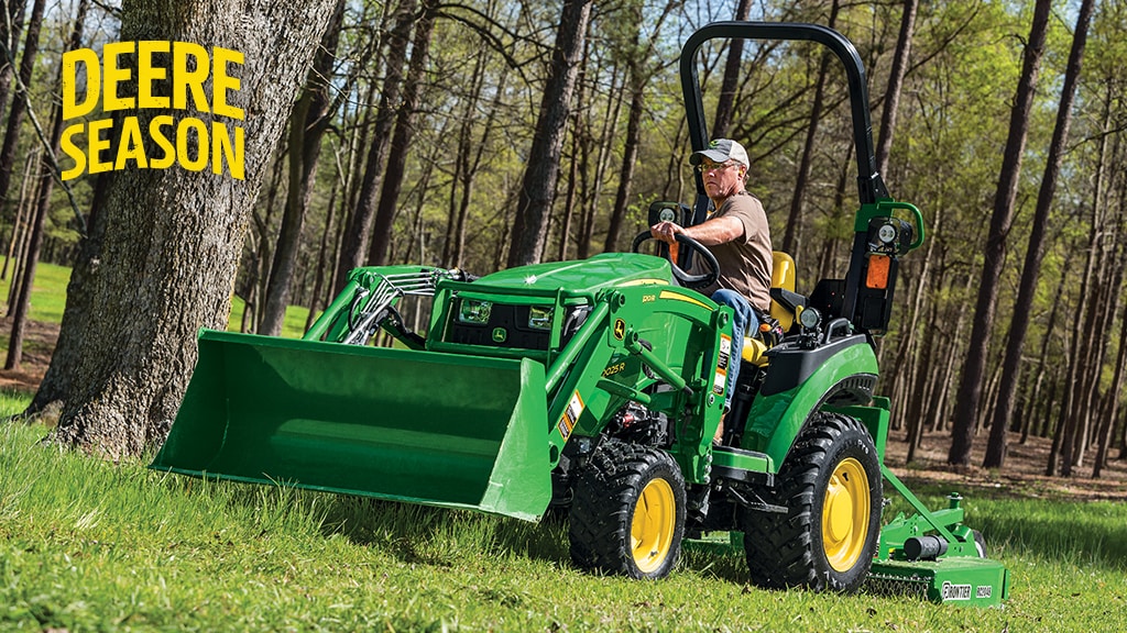 Farmer on a tractor in a forest
