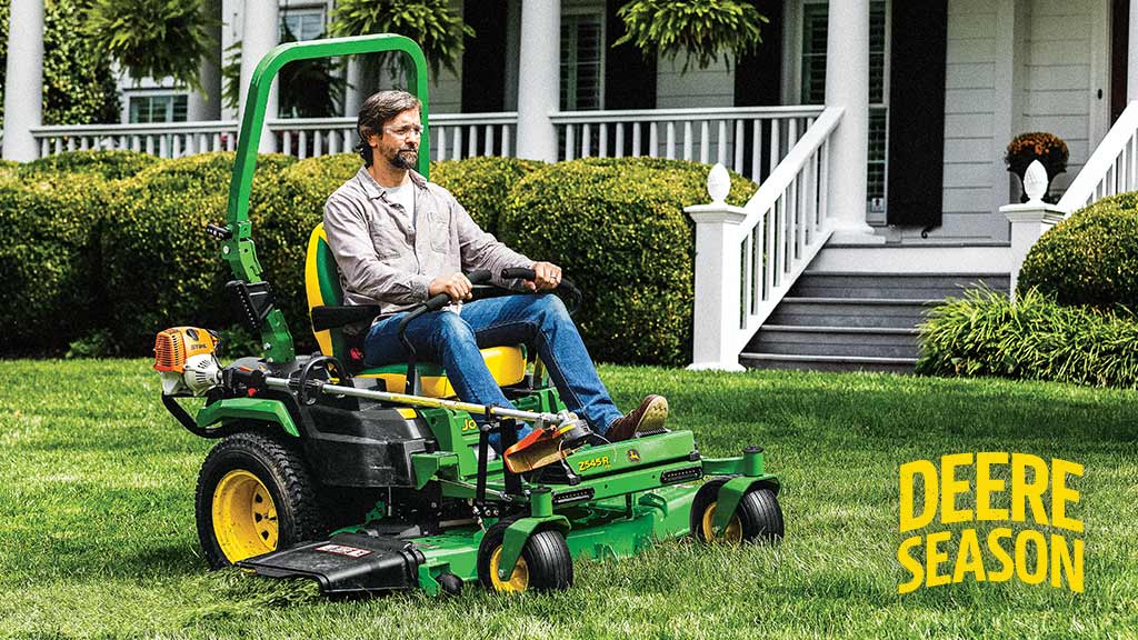 Person on a z545r cutting grass