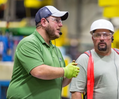 Employee speaking to the tour group