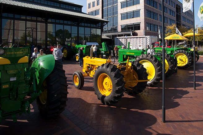 John Deere heritage tractors on display in front of the Pavilion