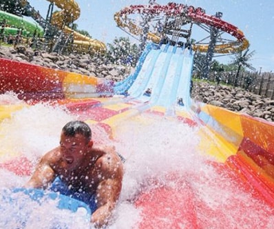 A man going down waterslide at the Lost Island Waterpark in Waterloo, IA