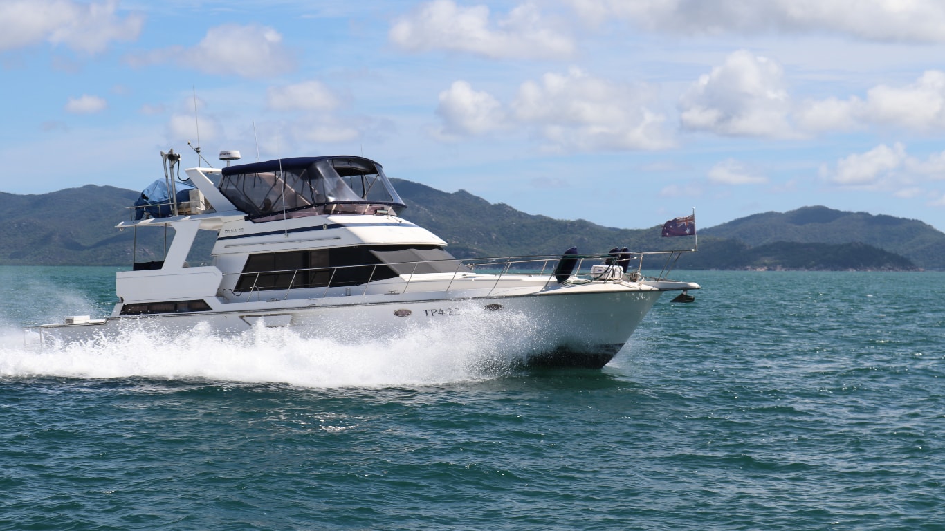 The John Deere-powered Five O’clock Somewhere, a Dyna 53 yacht sails the open sea.