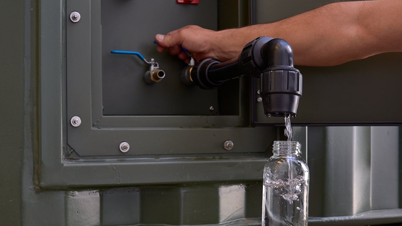 Water coming out of a GENAQ Cumulus C5000, powered by a John Deere 6.8L engine