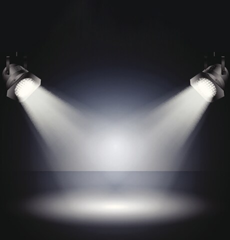 stage lights pointing a spotlight at the floor