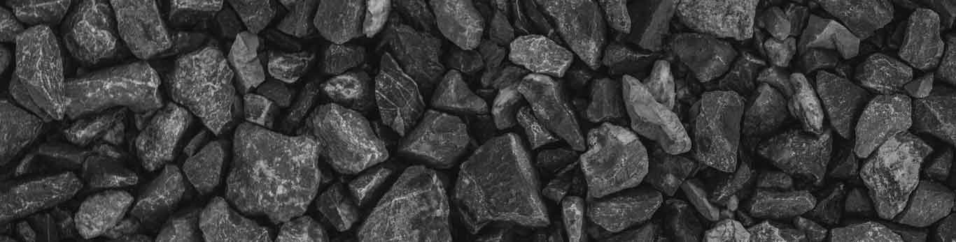 Close up image of black rocks in a rock pile