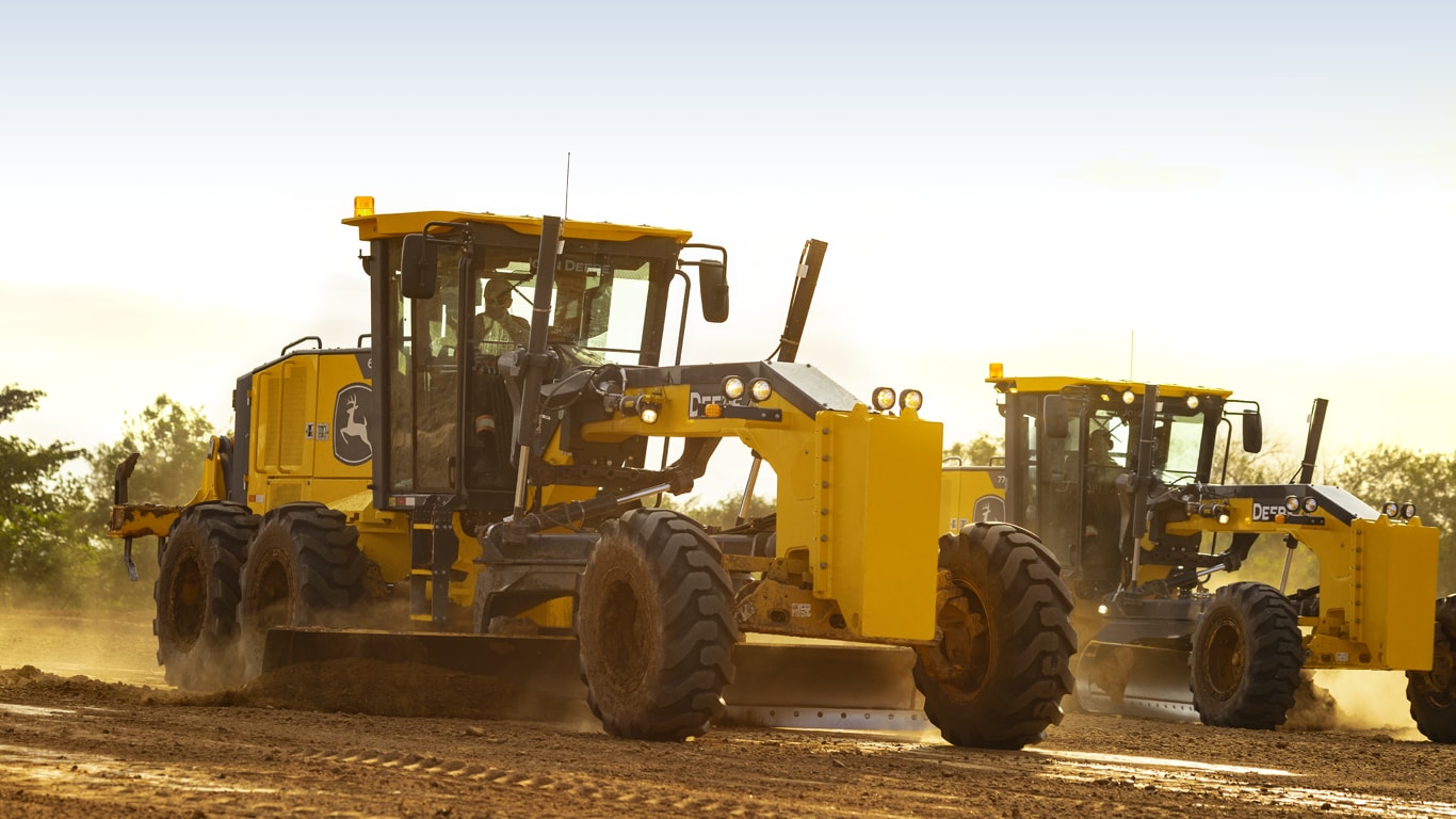 John Deere 620G Motor Graders working in tandem on a jobsite