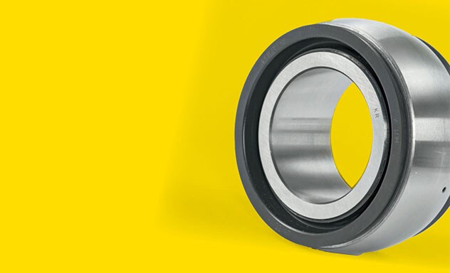 Image of a large metal bearing on a yellow background