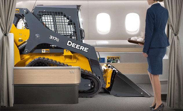 Artist's concept of a 317G Compact Track Loader enjoying an upgraded flight experience in first class with a flight attendant offering a hot towel