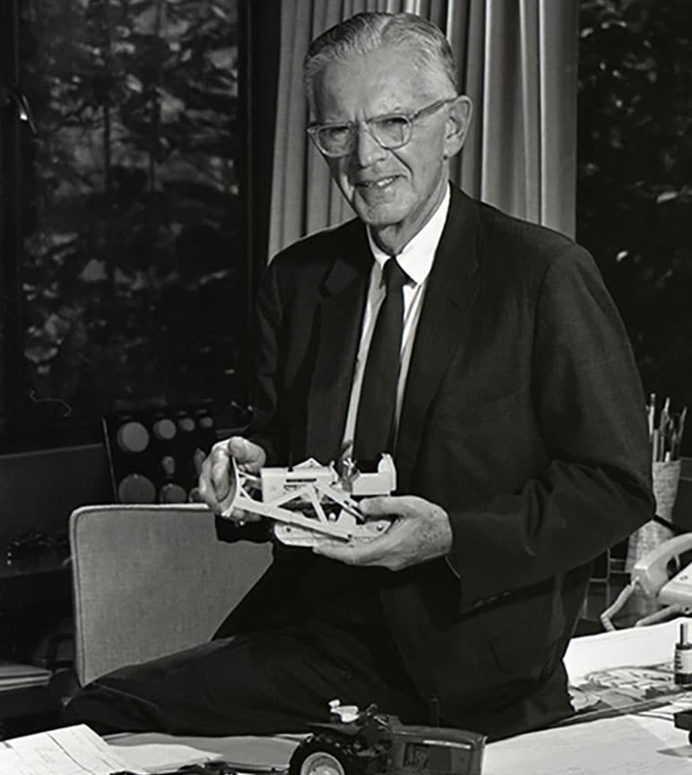 Henry Dreyfuss at desk (vintage Black and white photograph)