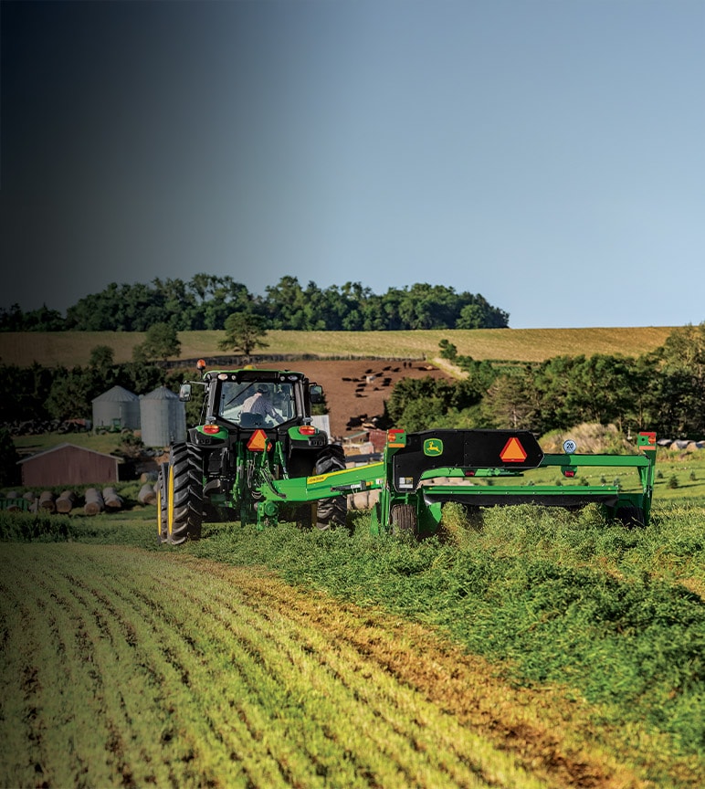 John Deere 9rx pulling Planter in a fallow field.