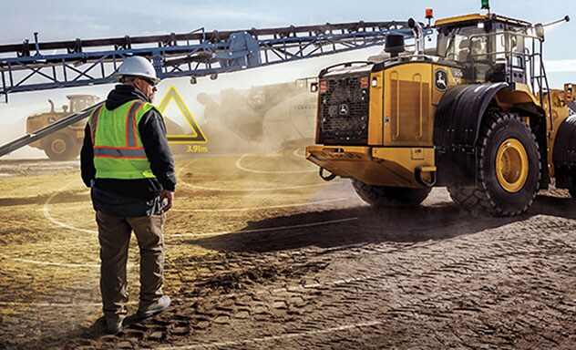 Man stands in front of John Deere Dozer