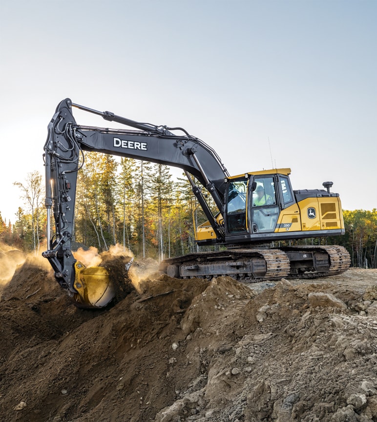 A new 230 P-Tier Excavator scoops a load of dirt on a construction jobsite