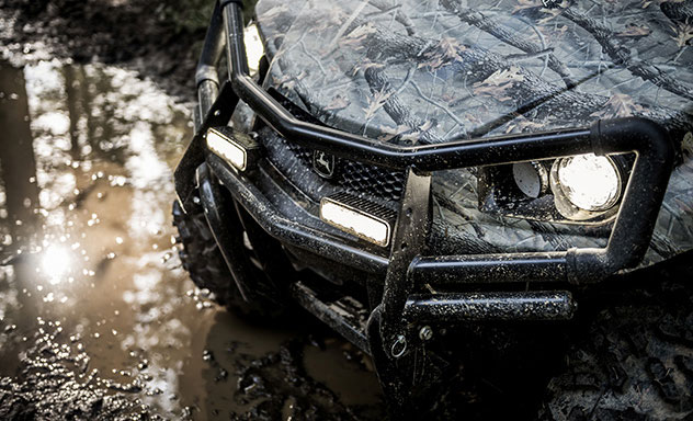Close up of a camouflage XUV590M Gator Utility Vehicle's bumper