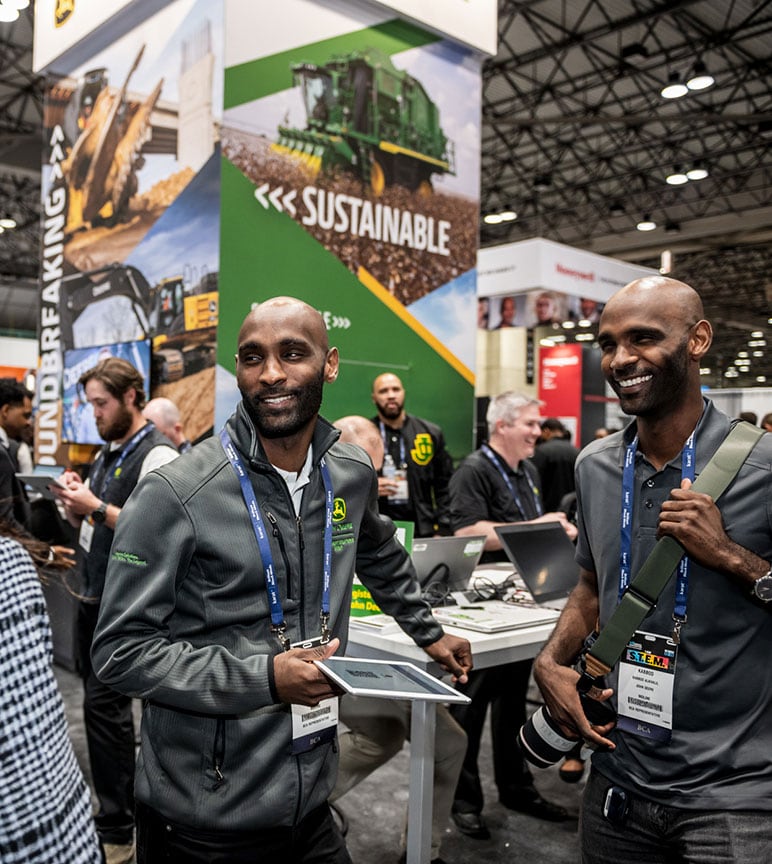 Mehawesh Alkhalil and Kabbod Alkhalil recruit tech talent at the National Society of Black Engineers John Deere booth