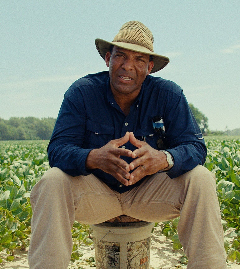 P.J. Haynie sitting by his crops.