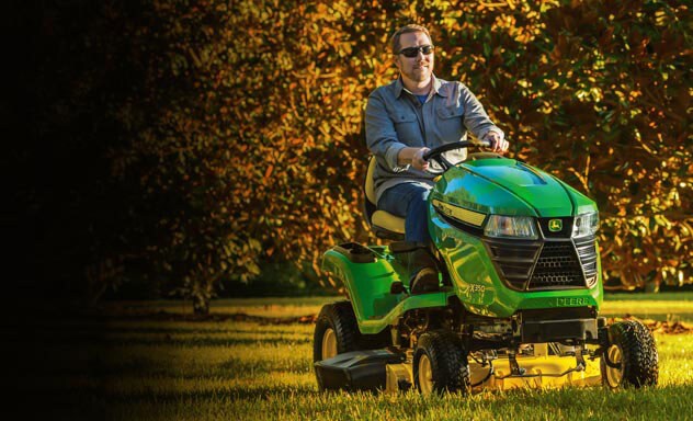 Man mowing lawn on an X350 lawn tractor