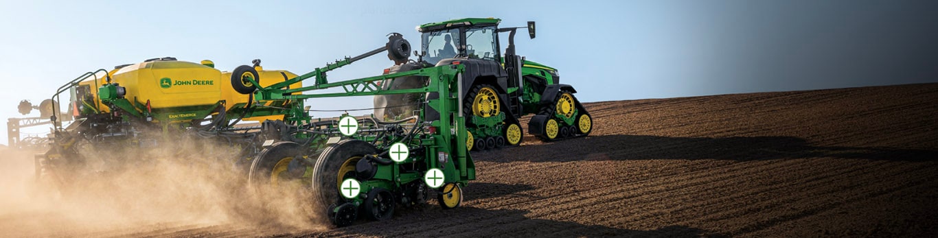 9 series tractor pulling a planter with overlayed hotspots on the planter.
