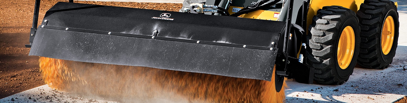 Closeup of Broom Attachment on Compact Equipment