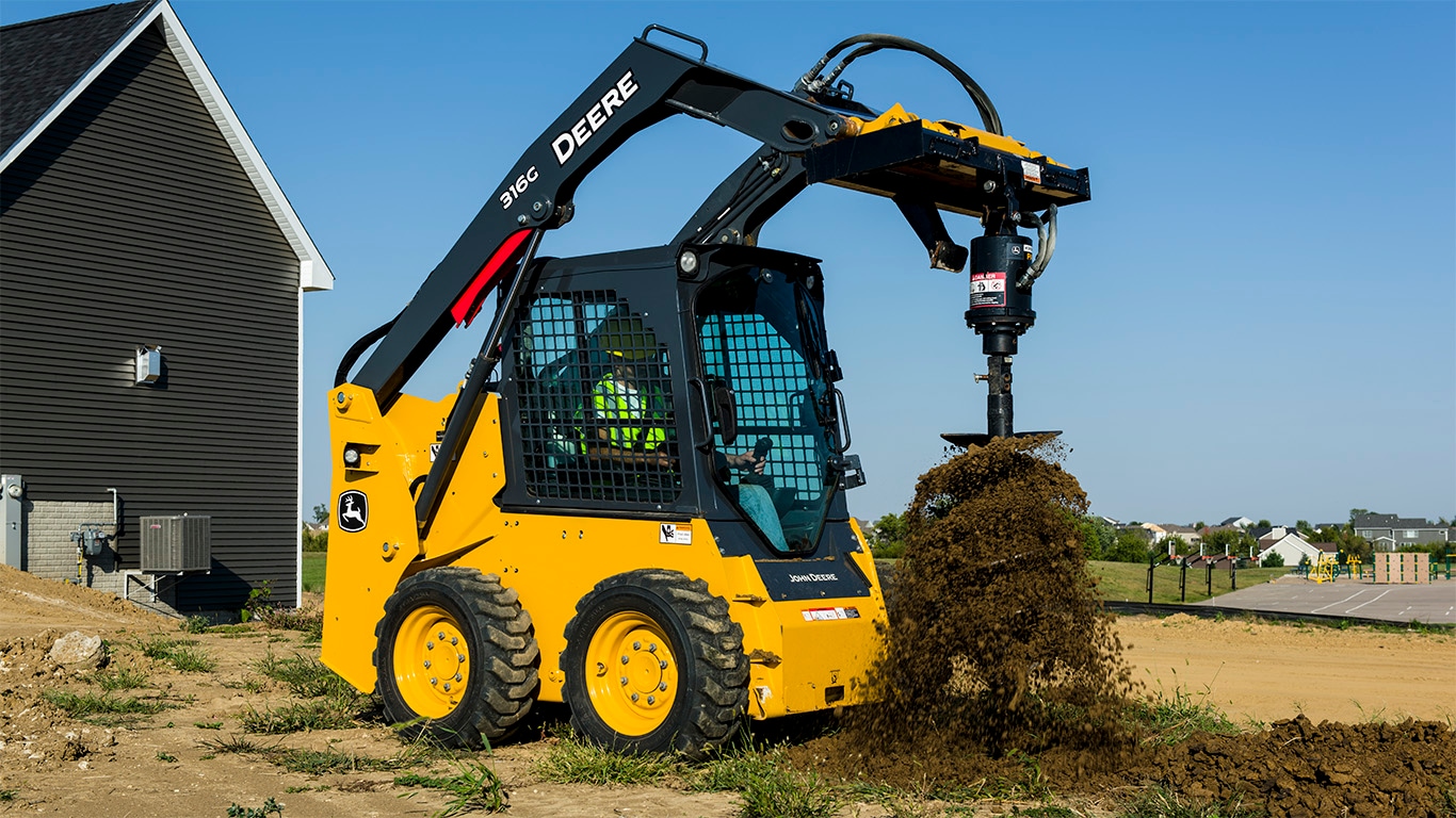 316G Skid Steer with Auger attachment digging a hole