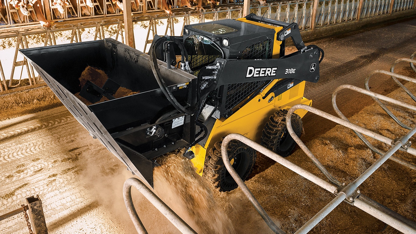 John Deere Skid Steer with Discharge Bucket Attachment