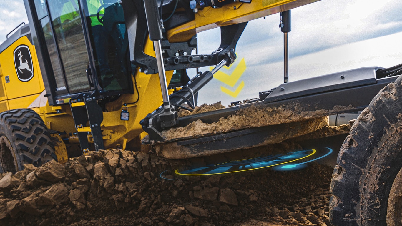 Close up of a John Deere motor grader blade with blue and yellow circles underneath the premium circle and yellow arrows pointing downward above the blade.