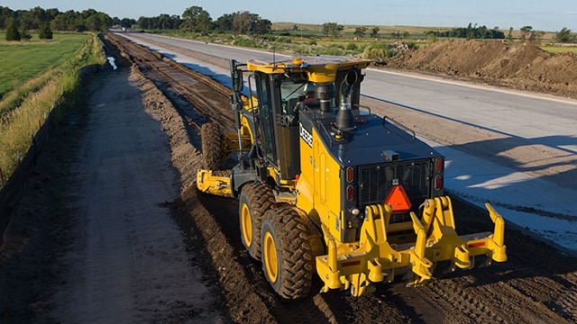 John Deere motorgrader working during road building.