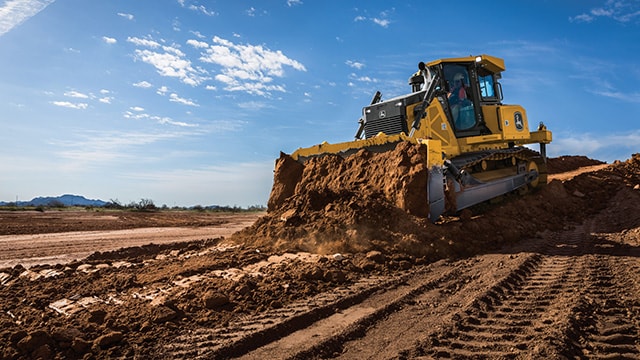 John Deere dozer on a construction site during development.