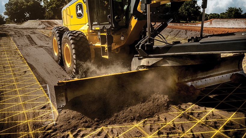 This is a composite image of a SmartGrade 872GP Motor Grader leveling the ground with grid lines on top of the dirt.