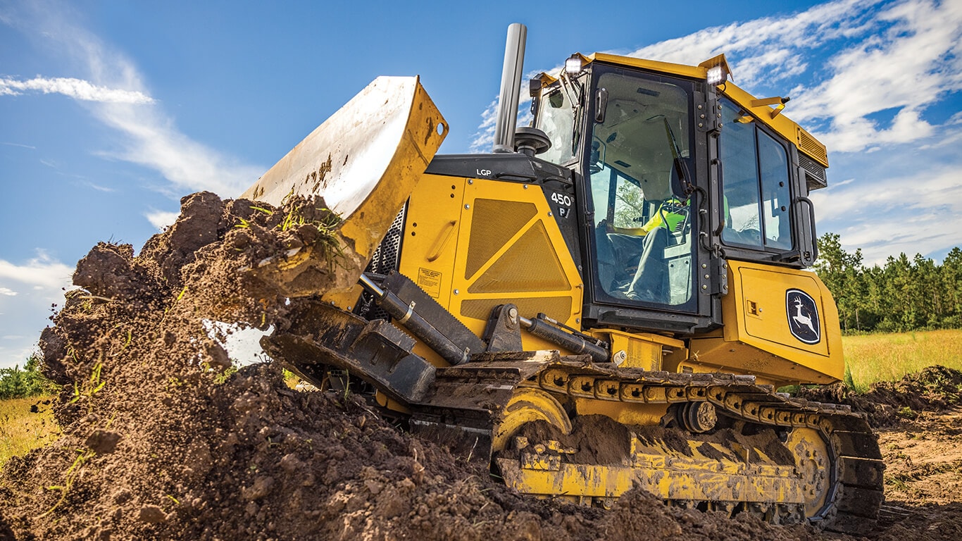 450 P-Tier dozer moving dirt on job site.