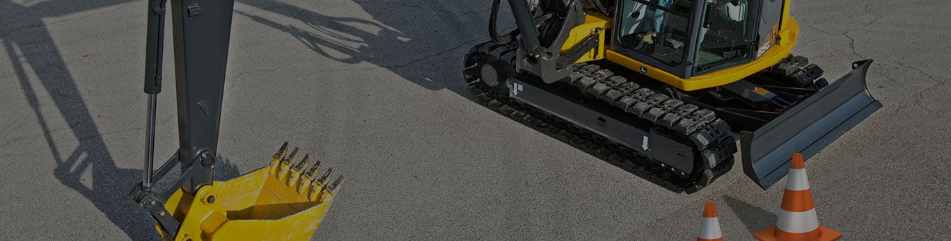 85G excavator in parking lot during operator challenge at World of concrete