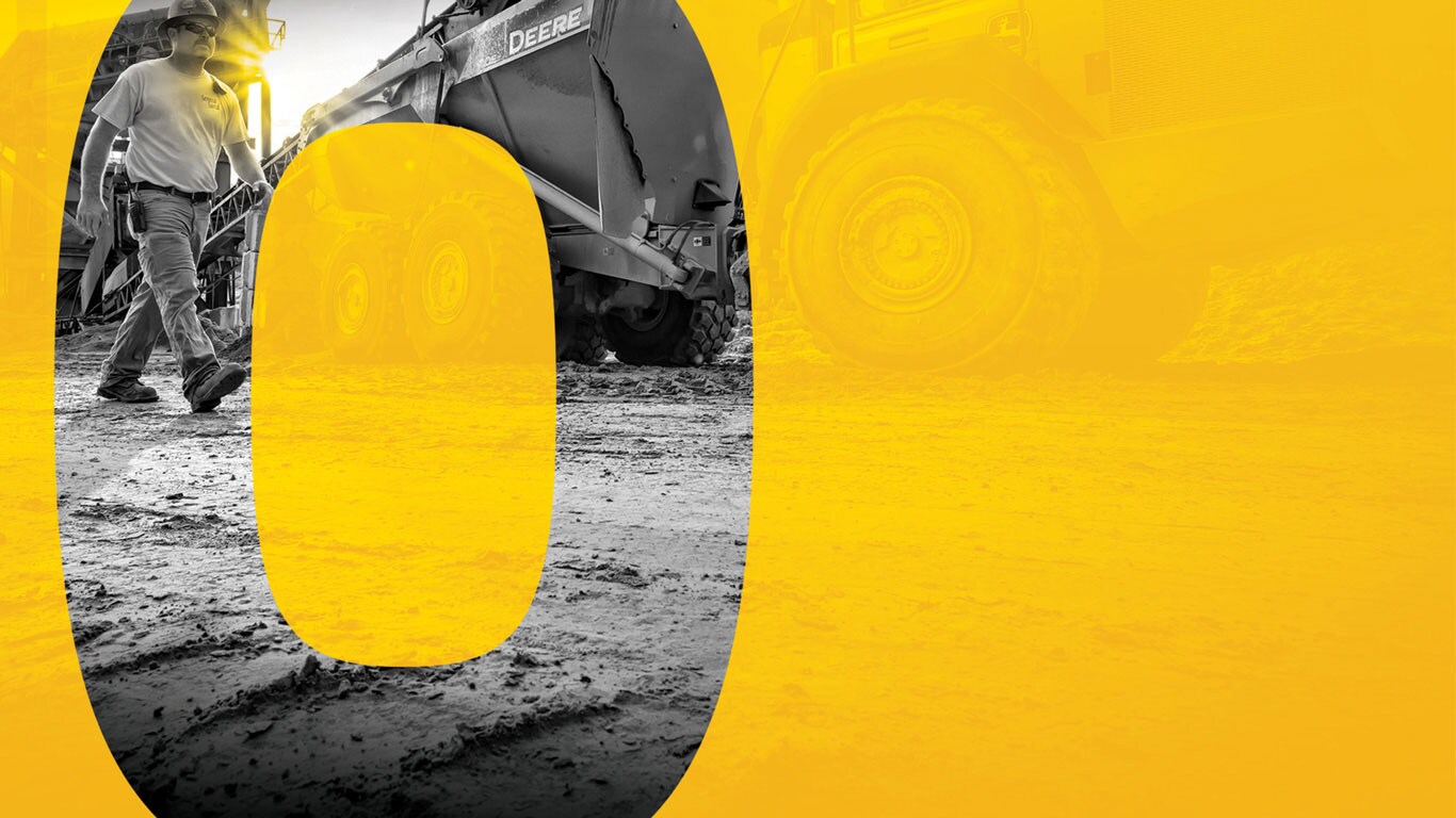 Technician walking next to a truck with a large 0 overlayed on top of the image