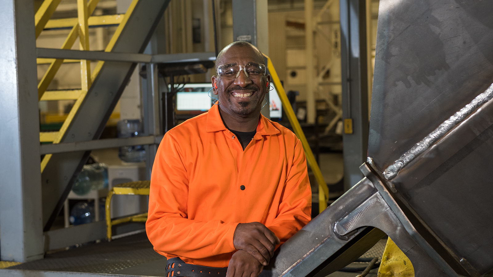 Jackie Daniels, a welder, shown working in the Deere-Hitachi factory