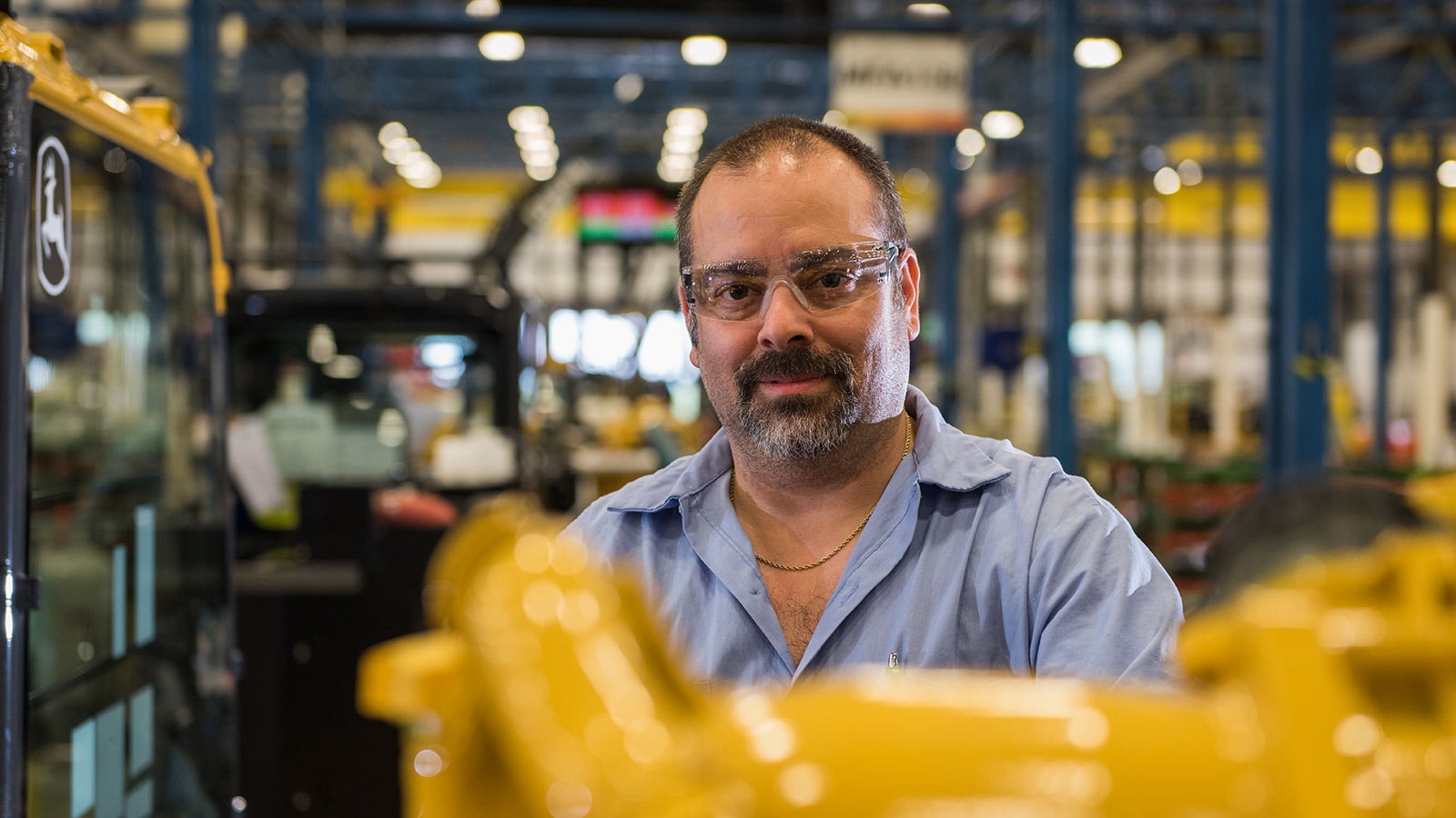 Sammy Flynt, Assembly Lead Technician, shown working in the Deere-Hitachi factory