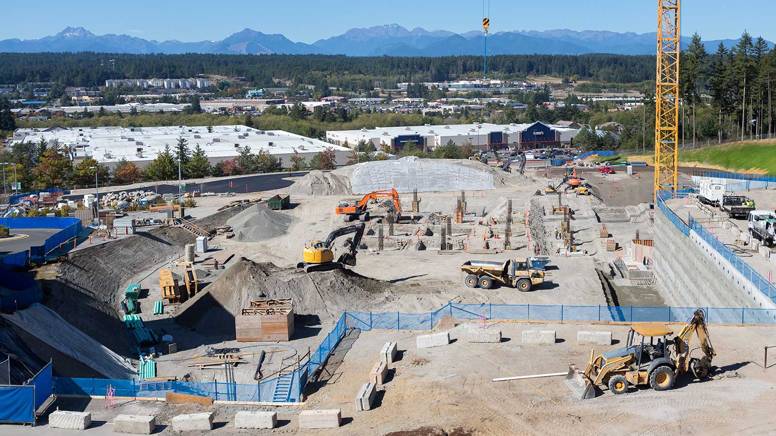 Deere dozers and excavators on a huge job site