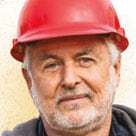 A head shot of Alvin Furr in a red hard hat