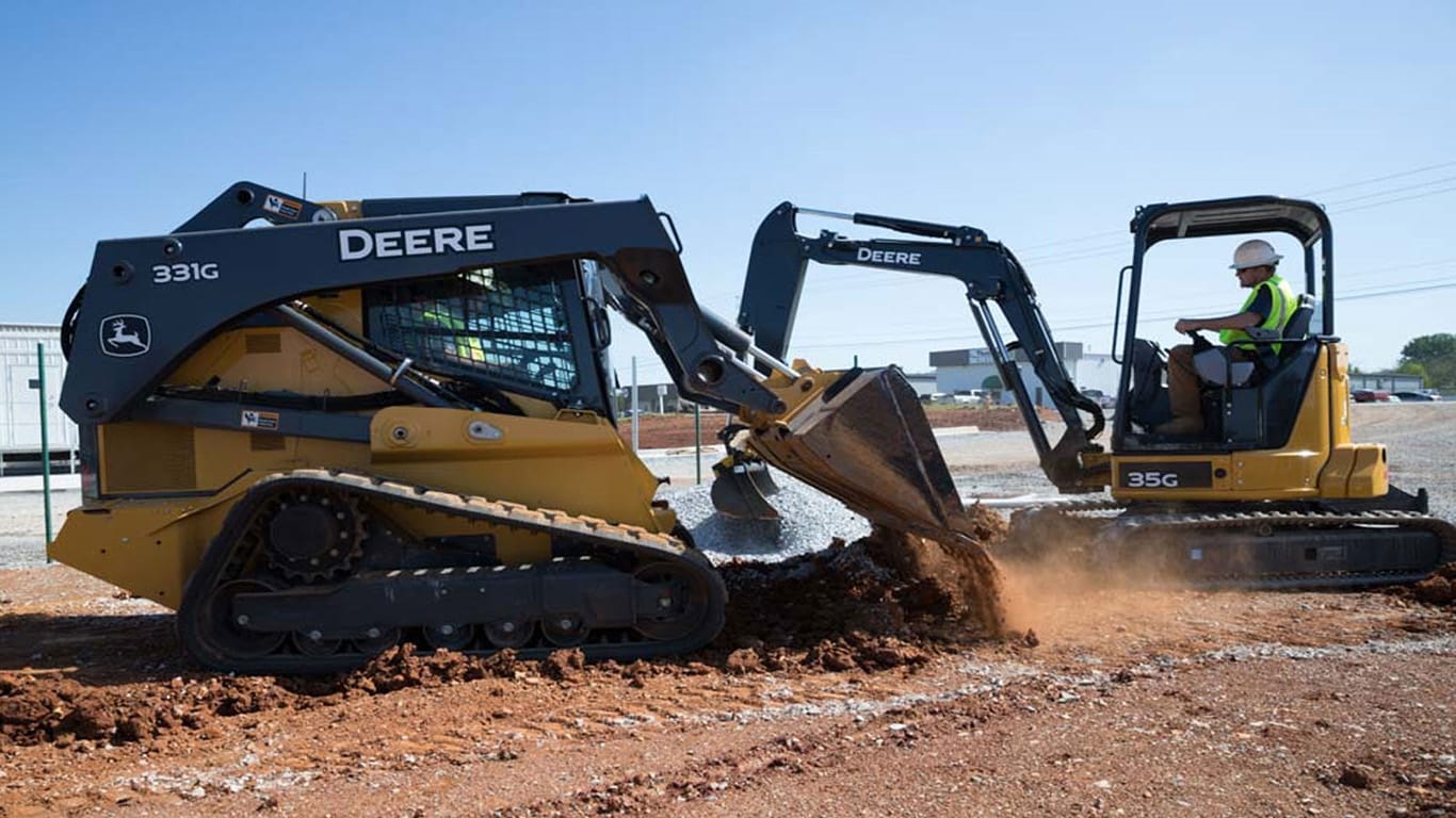 A 331G and a 35G work side by side on a construction site.