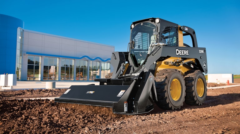 a skid steer using a rotary tiller