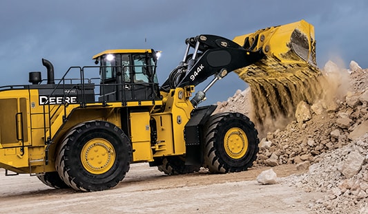a 944K loader shoveling dirt