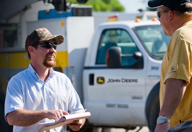 Two men discussing a warranty plan