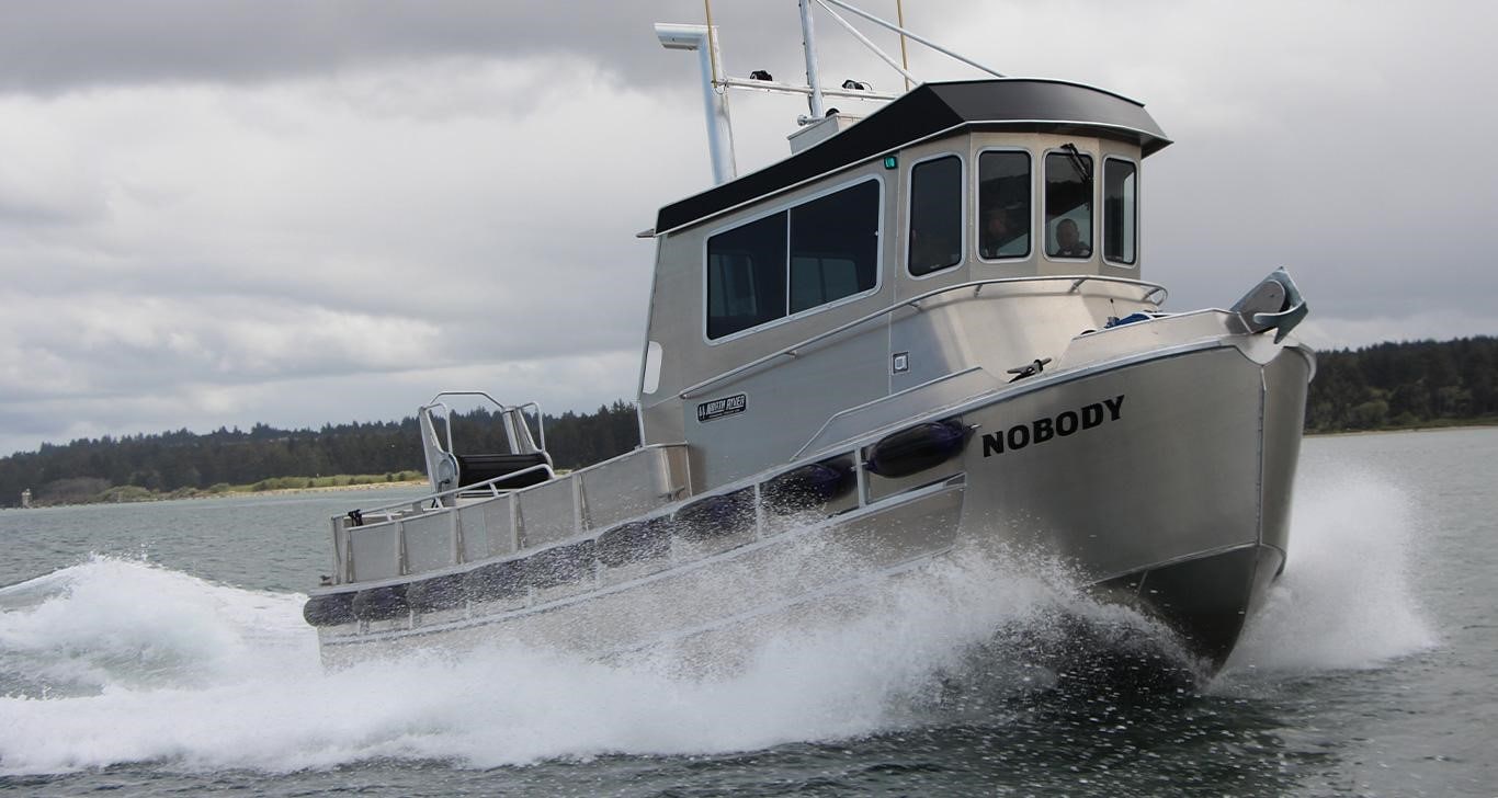 North River's new Bristol Bay sport fishing boat powered by a John Deere Marine engine cruising the water