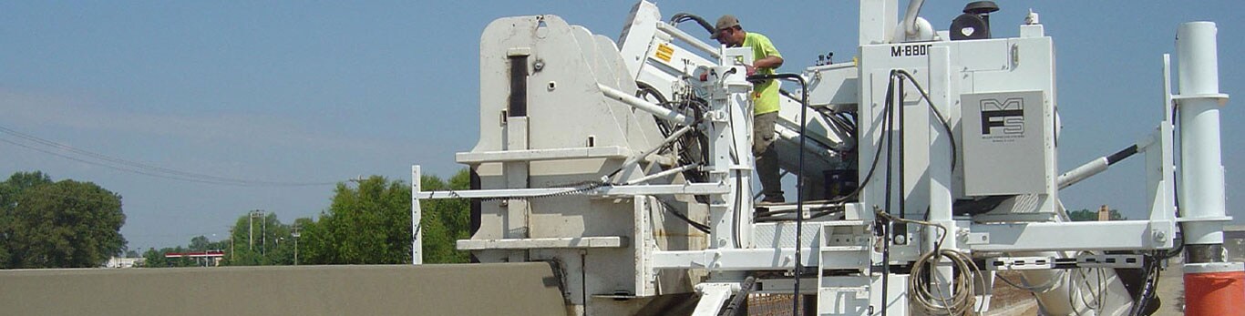 Man operating slipform paver