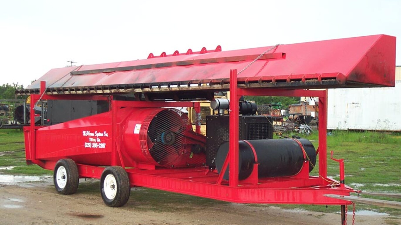 The McPherson Systems, Inc. M30F trench burner sitting in a grassy lot.