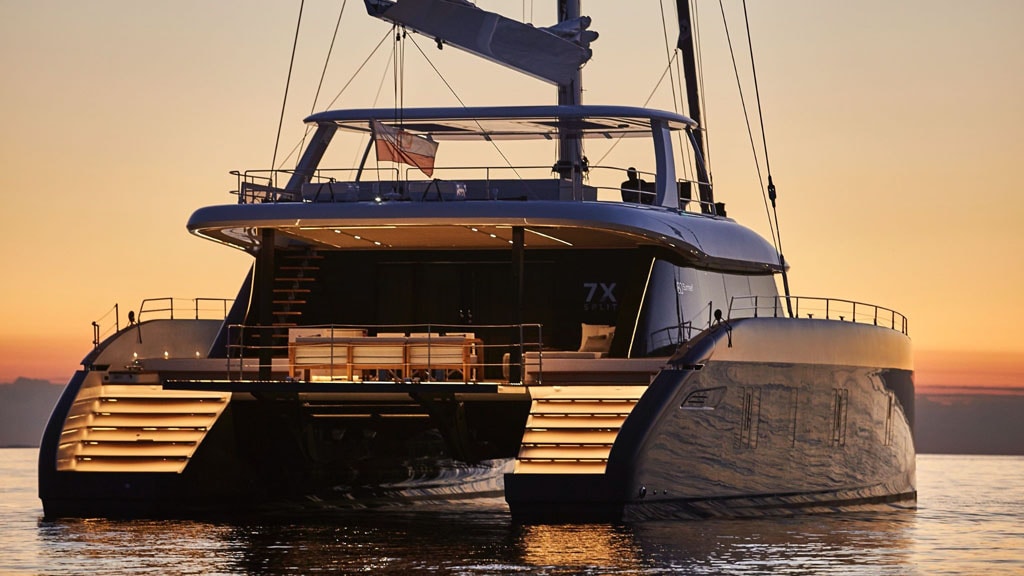 Sunreef Superyacht Powered By John Deere Marine Engines Sailing On Water During Sunset