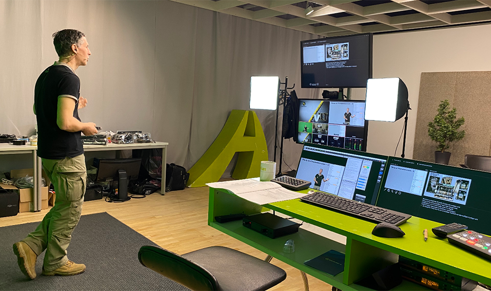 VILT instructor in front of monitors