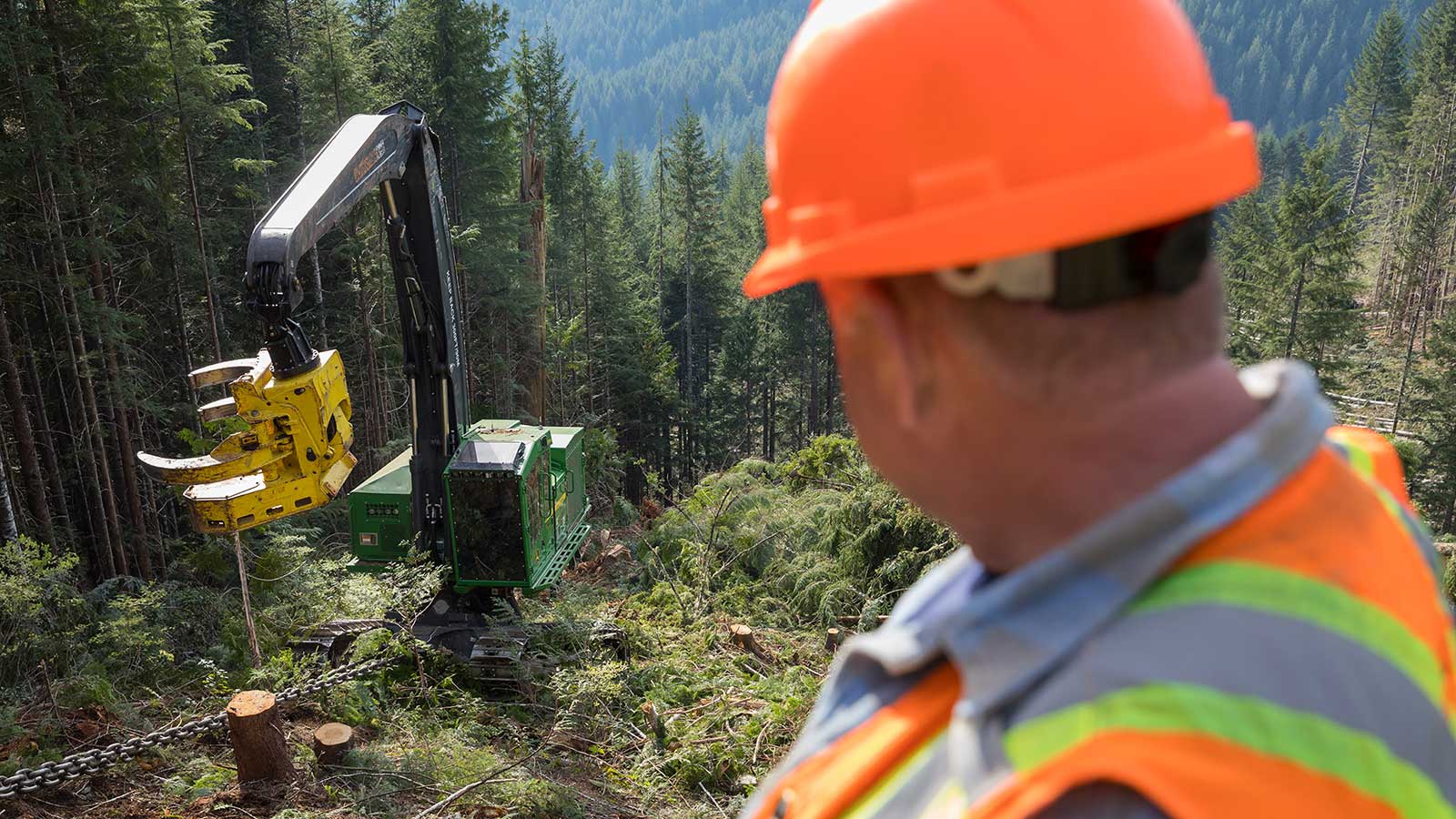 Newton looks down at machine on a steep slope