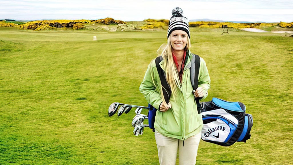 Kayla Kipp holding golf clubs on course